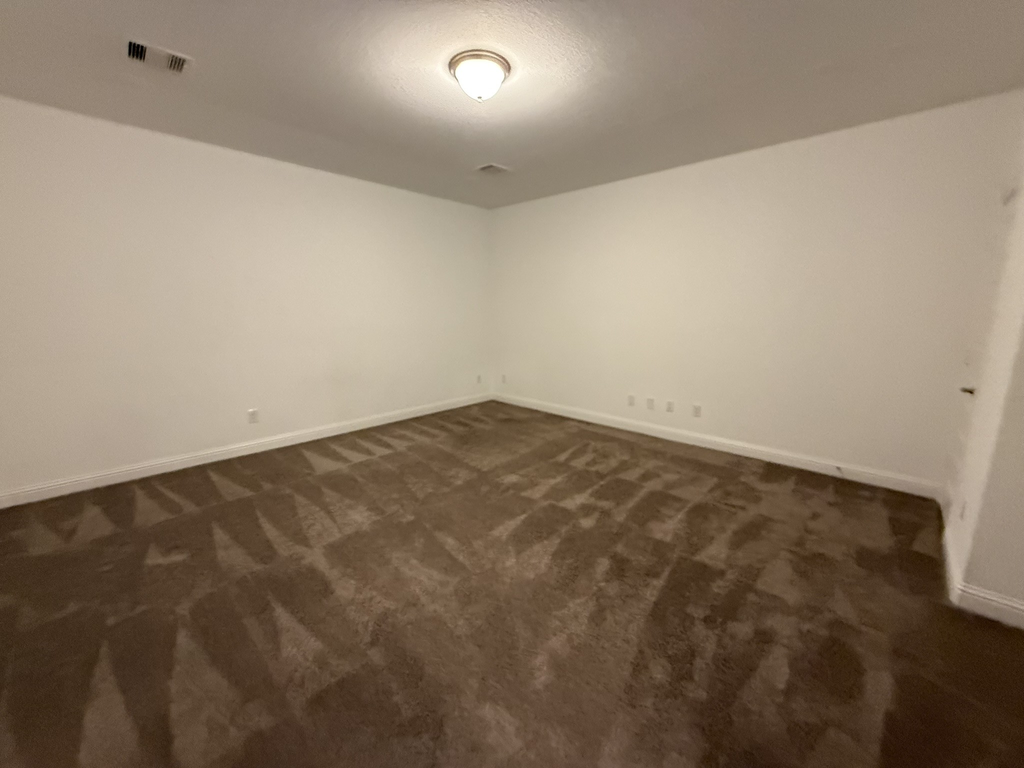 7802 Wayman Pass Fulshear, TX 77441 - Photo 37 of 50 an empty room with a workbench