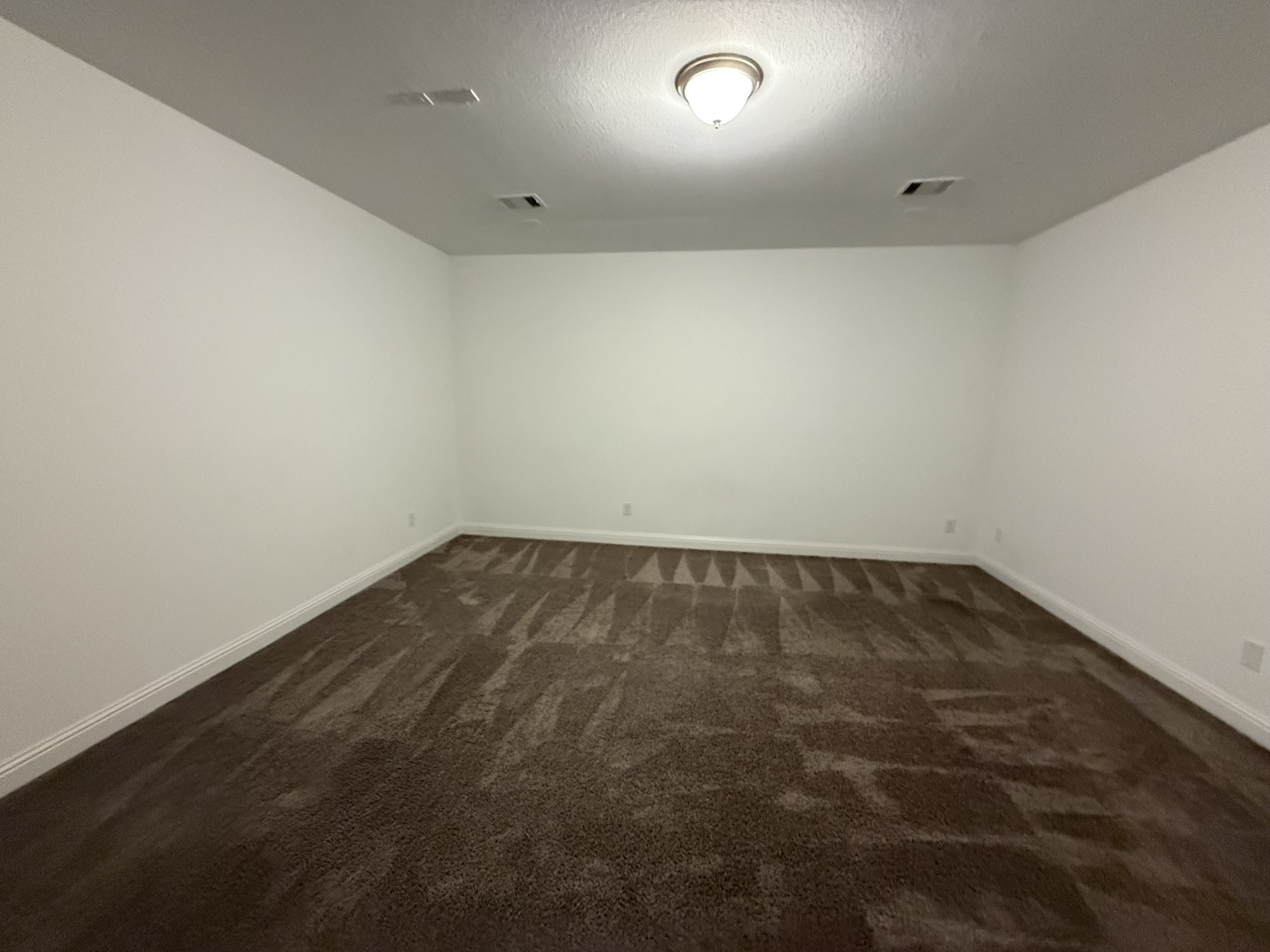 7802 Wayman Pass Fulshear, TX 77441 - Photo 38 of 50 an empty room with a workbench