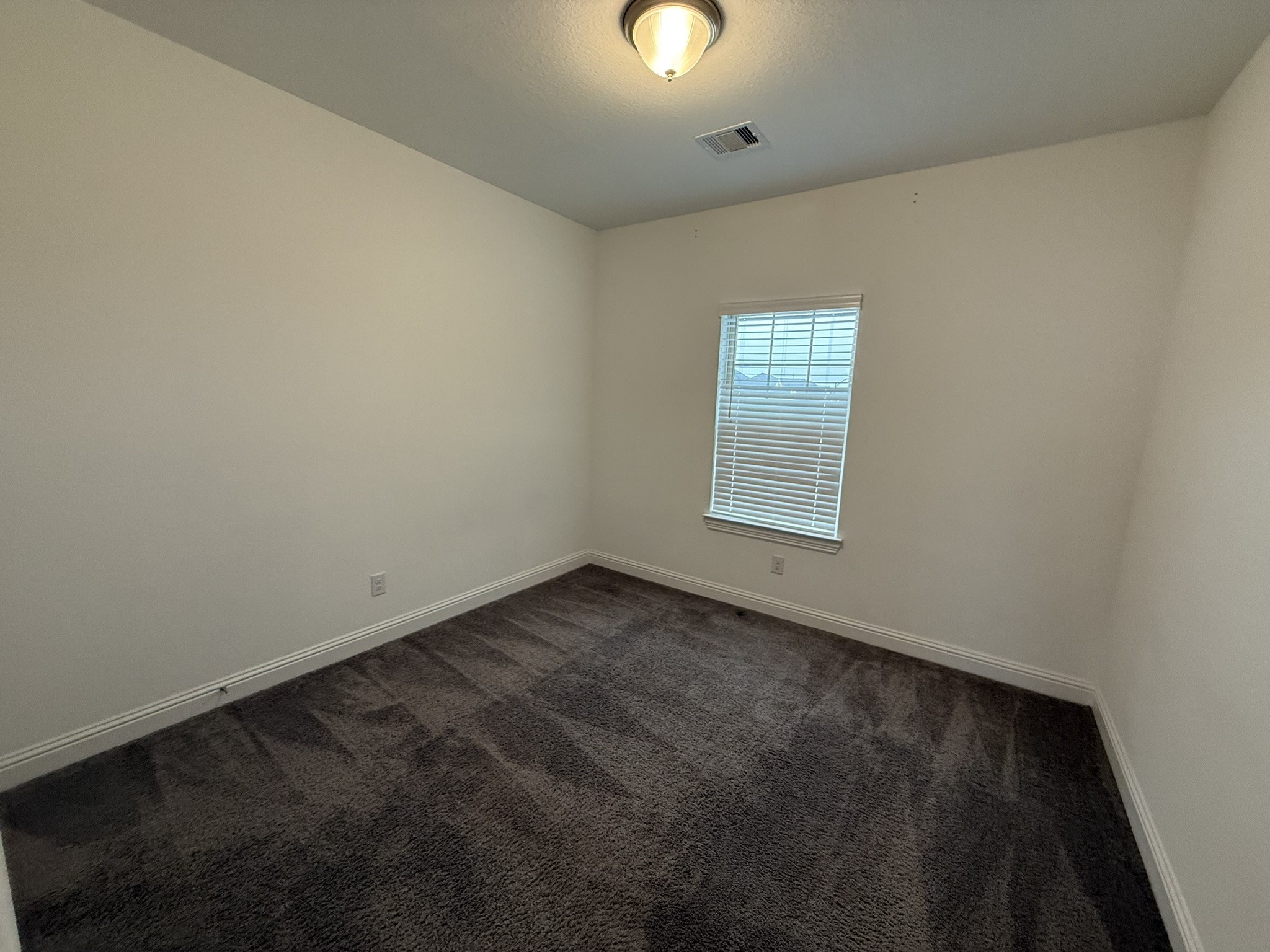 7802 Wayman Pass Fulshear, TX 77441 - Photo 41 of 50 an empty room with windows