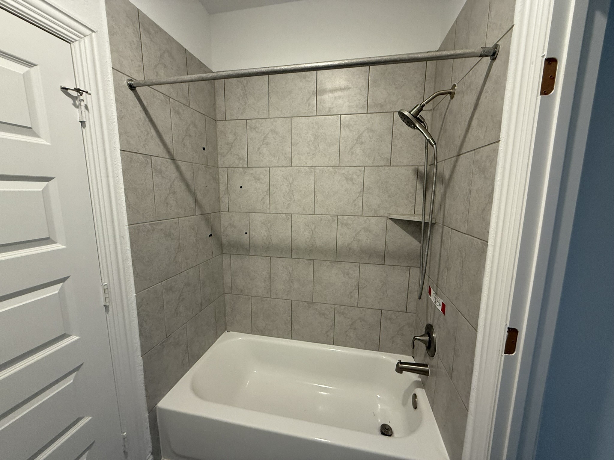 7802 Wayman Pass Fulshear, TX 77441 - Photo 45 of 50 a bathroom with a bathtub