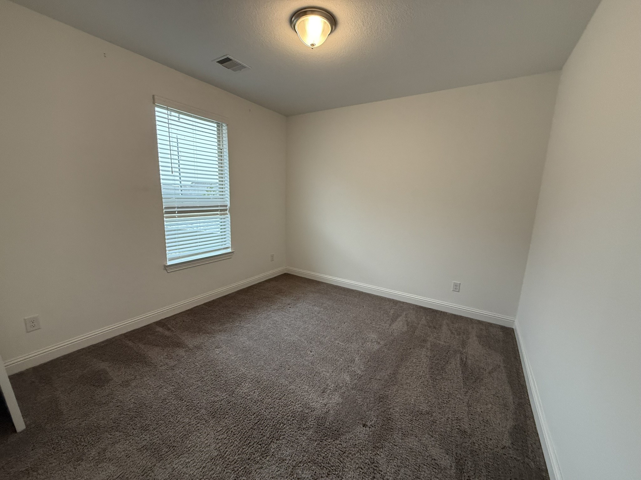 7802 Wayman Pass Fulshear, TX 77441 - Photo 46 of 50 an empty room with windows