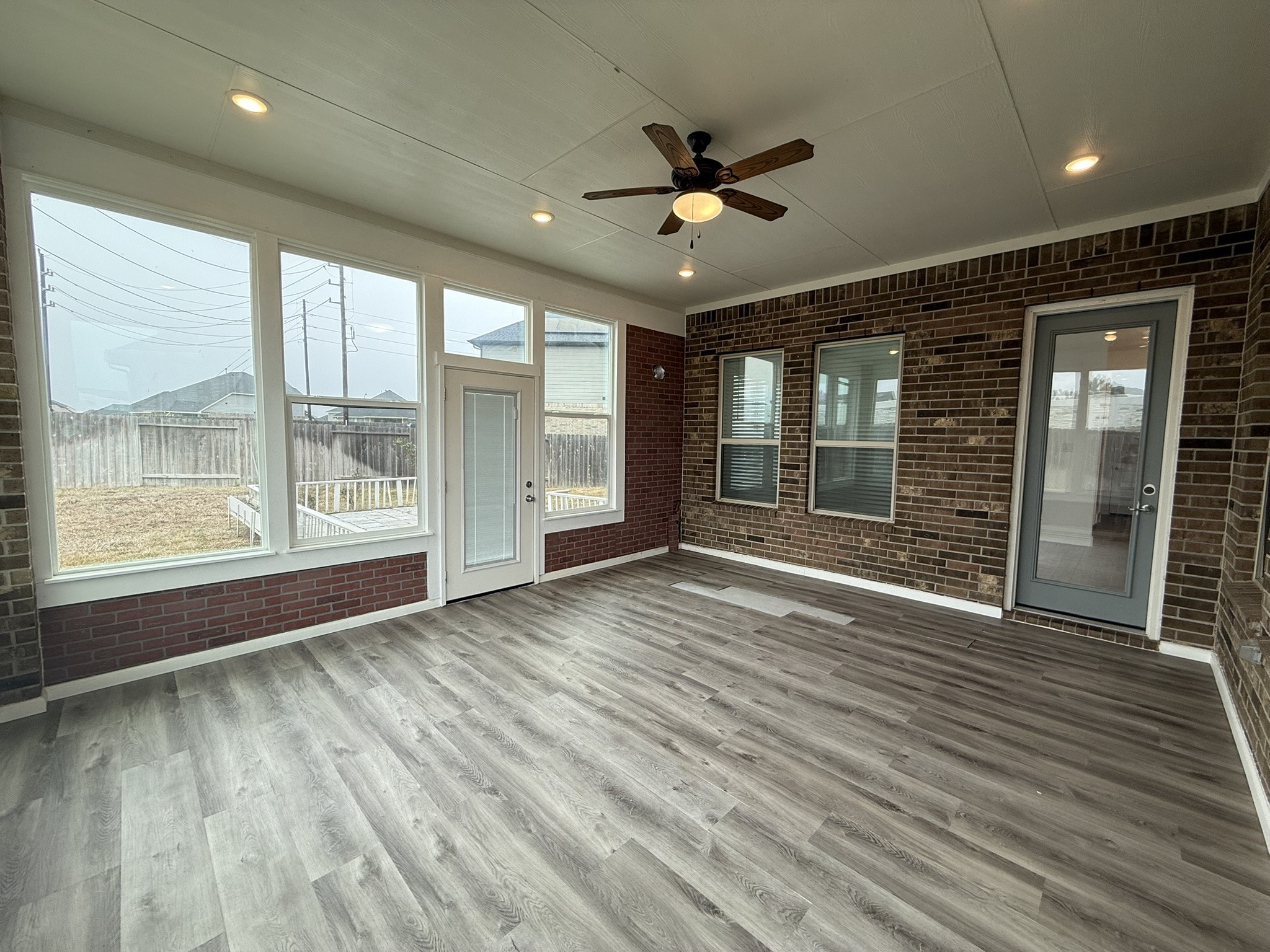 7802 Wayman Pass Fulshear, TX 77441 - Photo 49 of 50 a view of an empty room with a window and wooden floor