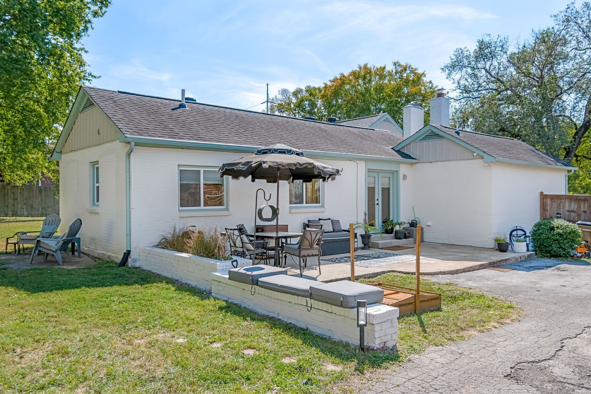 1136 Pierce Road Madison, TN 37115 - Photo 47 of 63 a view of a patio with table and chairs under an umbrella