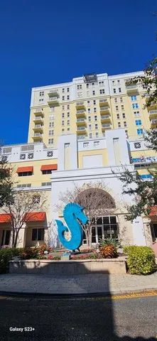 view of building with car parked