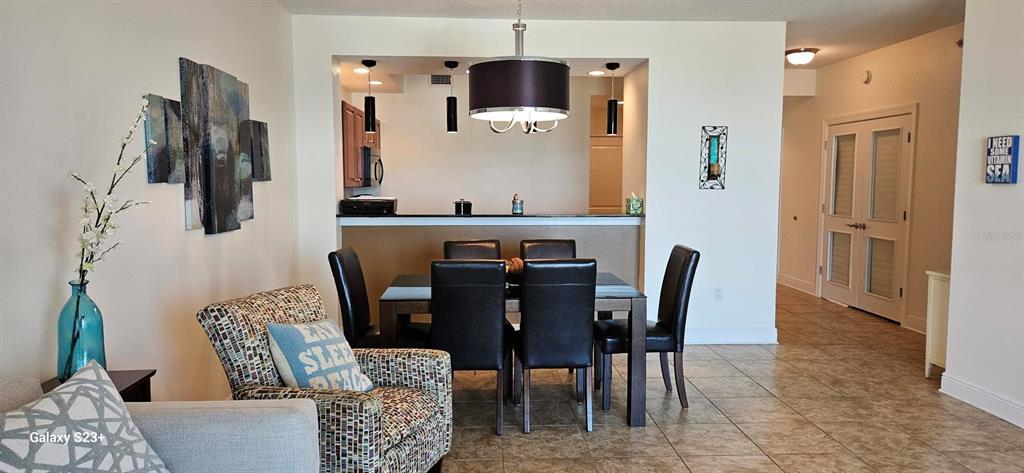 628 Cleveland Street, Unit 1207 Clearwater, FL 33755 - Photo 11 of 36 a view of a dining room with furniture