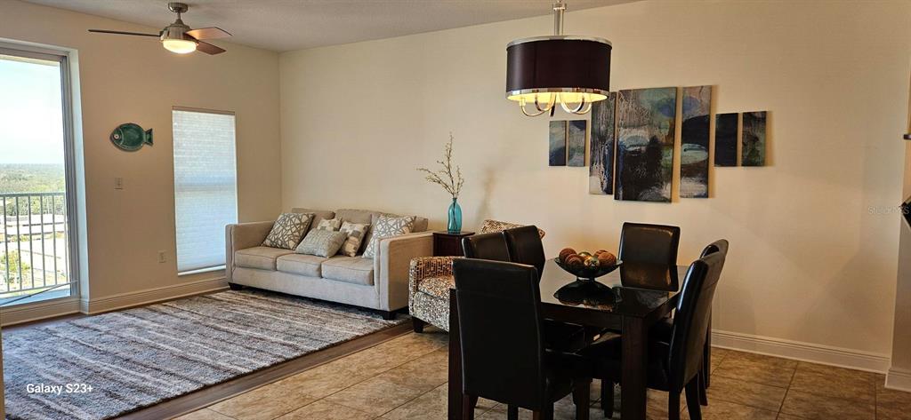 628 Cleveland Street, Unit 1207 Clearwater, FL 33755 - Photo 12 of 36 a living room with furniture and wooden floor