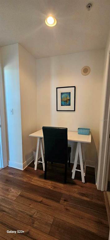 628 Cleveland Street, Unit 1207 Clearwater, FL 33755 - Photo 15 of 36 a living room with furniture and a wooden floor