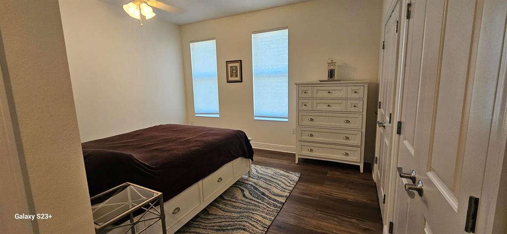 628 Cleveland Street, Unit 1207 Clearwater, FL 33755 - Photo 16 of 36 a room with a dresser and a mirror
