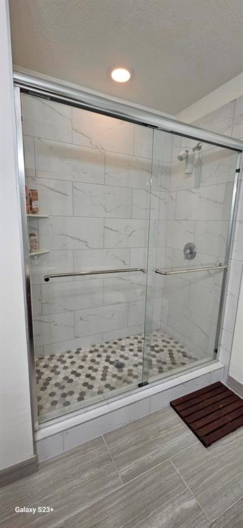 628 Cleveland Street, Unit 1207 Clearwater, FL 33755 - Photo 19 of 36 a bathroom with a shower