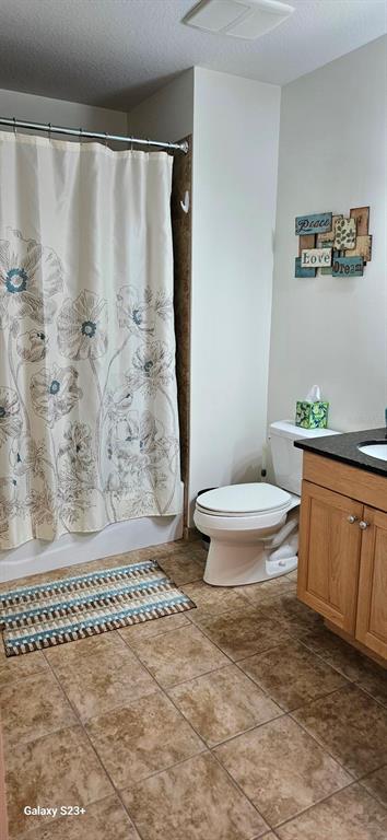 628 Cleveland Street, Unit 1207 Clearwater, FL 33755 - Photo 24 of 36 a bathroom with a toilet and a shower