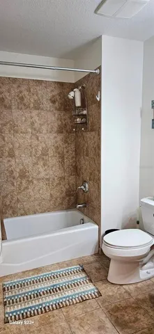 a view of an empty room and staircase