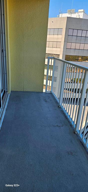 628 Cleveland Street, Unit 1207 Clearwater, FL 33755 - Photo 28 of 36 a view of an empty room and staircase