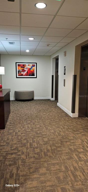 628 Cleveland Street, Unit 1207 Clearwater, FL 33755 - Photo 31 of 36 a view of a hallway with a hallway