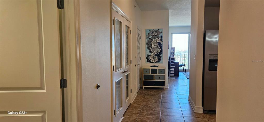 628 Cleveland Street, Unit 1207 Clearwater, FL 33755 - Photo 5 of 36 a view of a hallway with wooden floor and windows