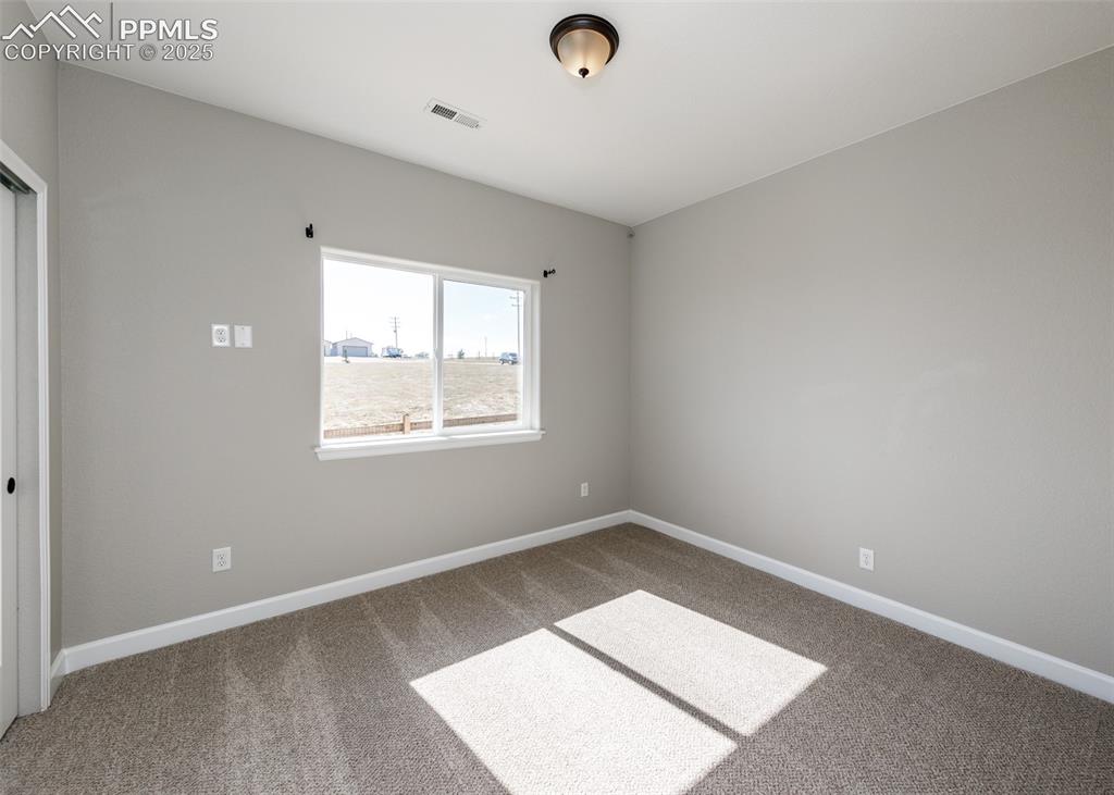 2105 Slocum Road Peyton, CO 80831 - Photo 23 of 27 Another secondary bedroom.