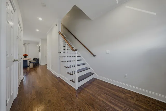 a view of an entryway with wooden floor