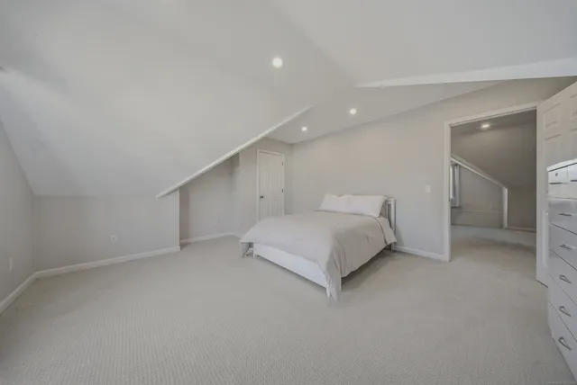 en suite bathroom with a toilet sink and mirror