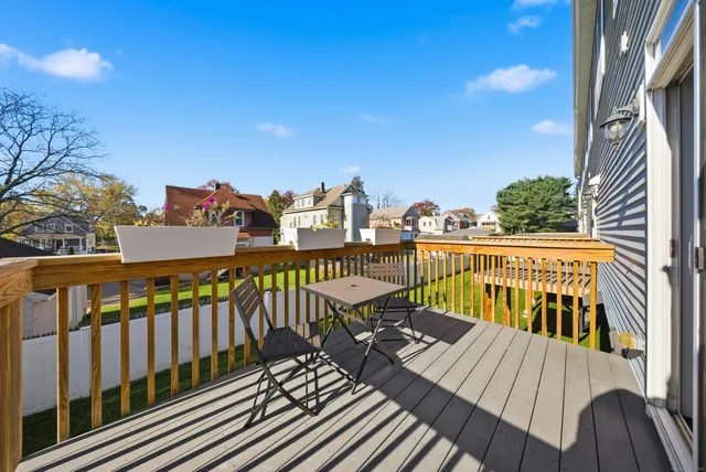 a view of a balcony with chairs