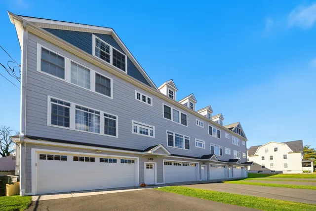 a front view of building with yard