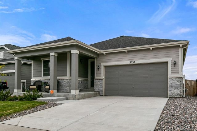 a front view of a house with a garage