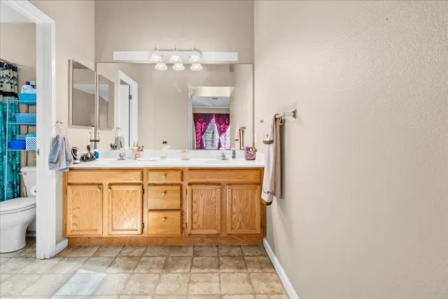 a bathroom with a sink a vanity and a mirror