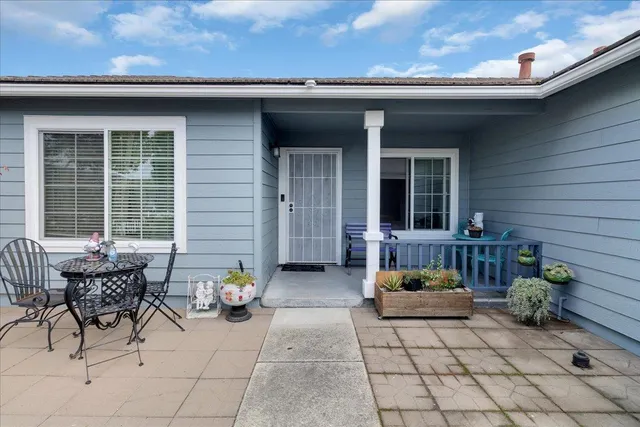 a view of a house with chairs in patio