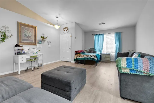 a living room with furniture and a window