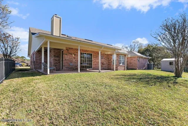 a view of a lake with a house in the background