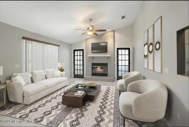 a living room with furniture and a fireplace