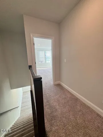 a view of an empty room with a fireplace