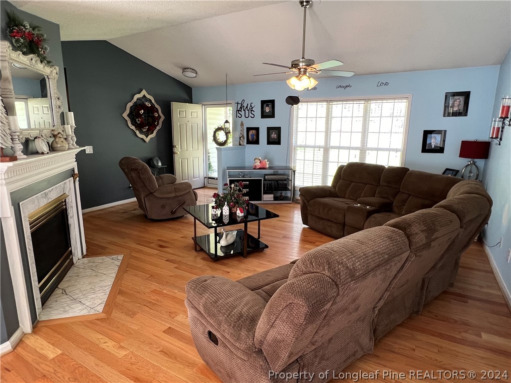2196 Post Office Road Sanford, NC 27330 - Photo 6 of 21 a living room with furniture window and fireplace