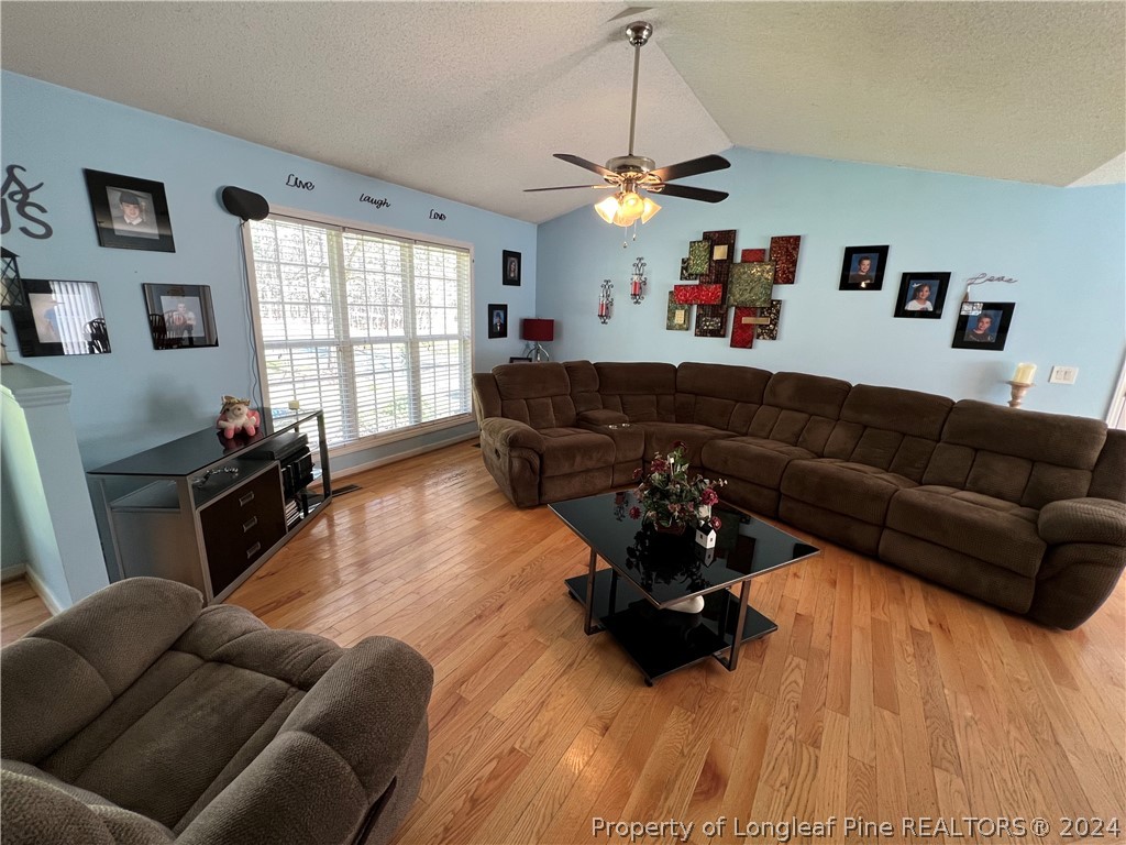 2196 Post Office Road Sanford, NC 27330 - Photo 8 of 21 a living room with furniture window and wooden floor