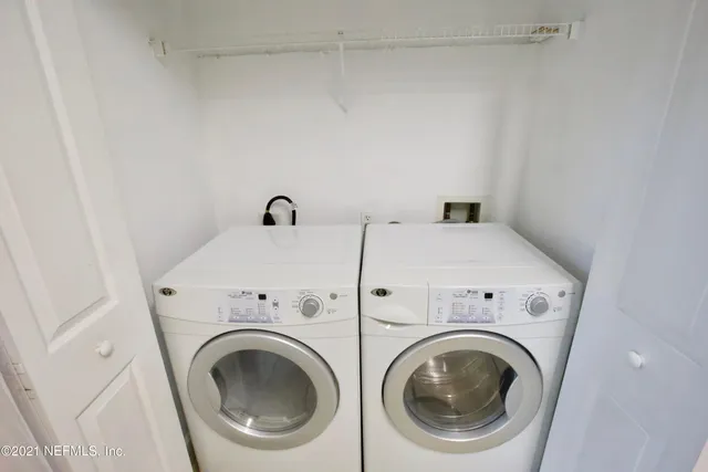 a utility room with dryer and washer