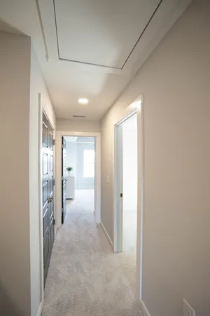 a view of hallway with wooden floor