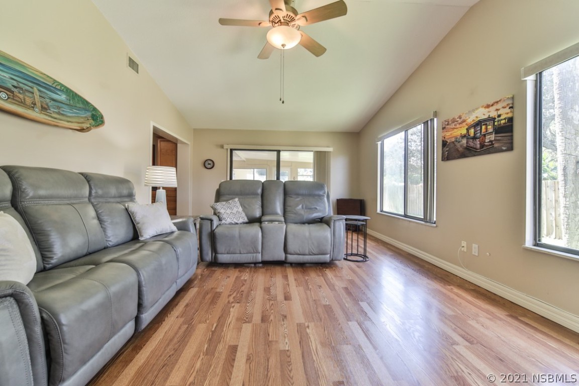700 Green Road New Smyrna Beach, FL 32168 - Photo 12 of 37 a living room with furniture and a window