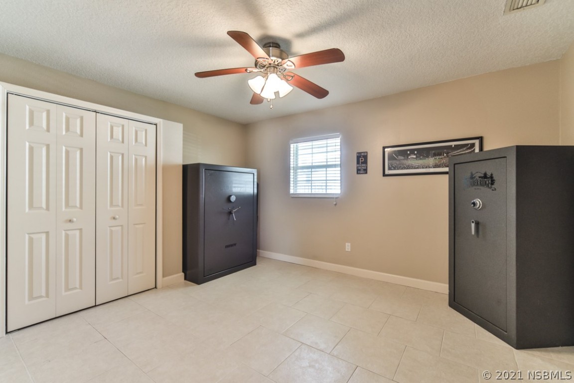 700 Green Road New Smyrna Beach, FL 32168 - Photo 24 of 37 an empty room with closet and windows