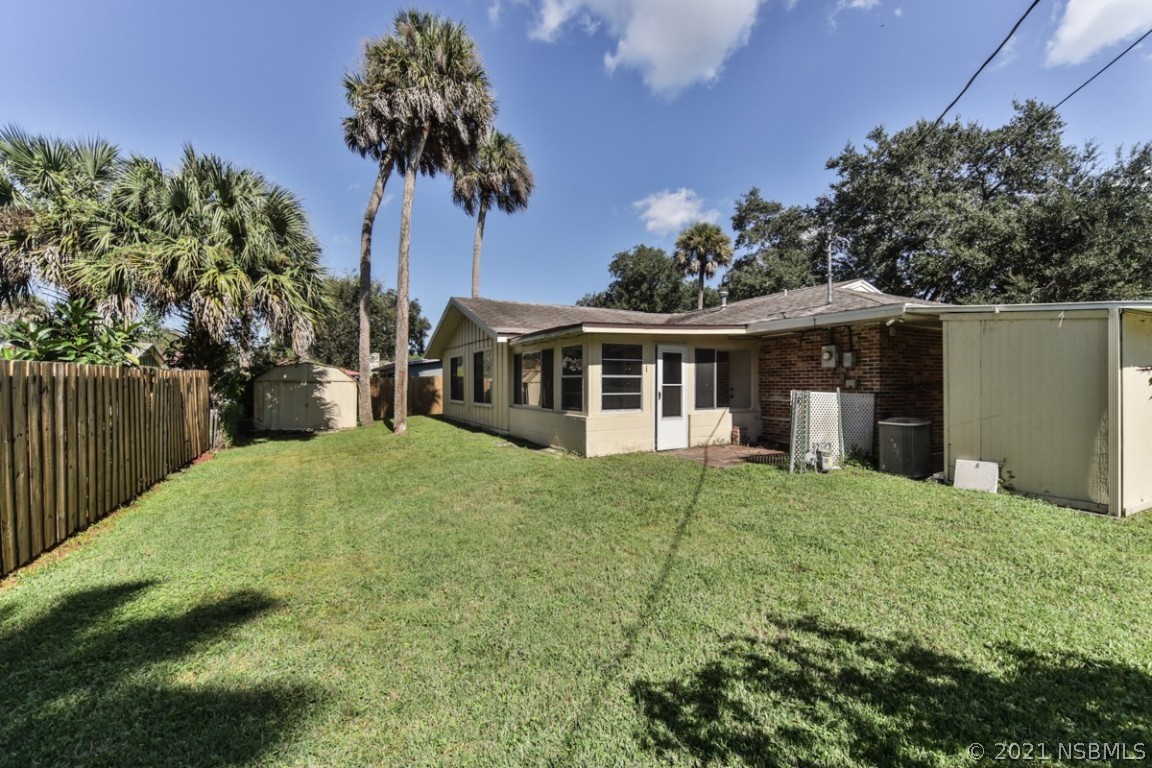 700 Green Road New Smyrna Beach, FL 32168 - Photo 33 of 37 a house with trees in the background