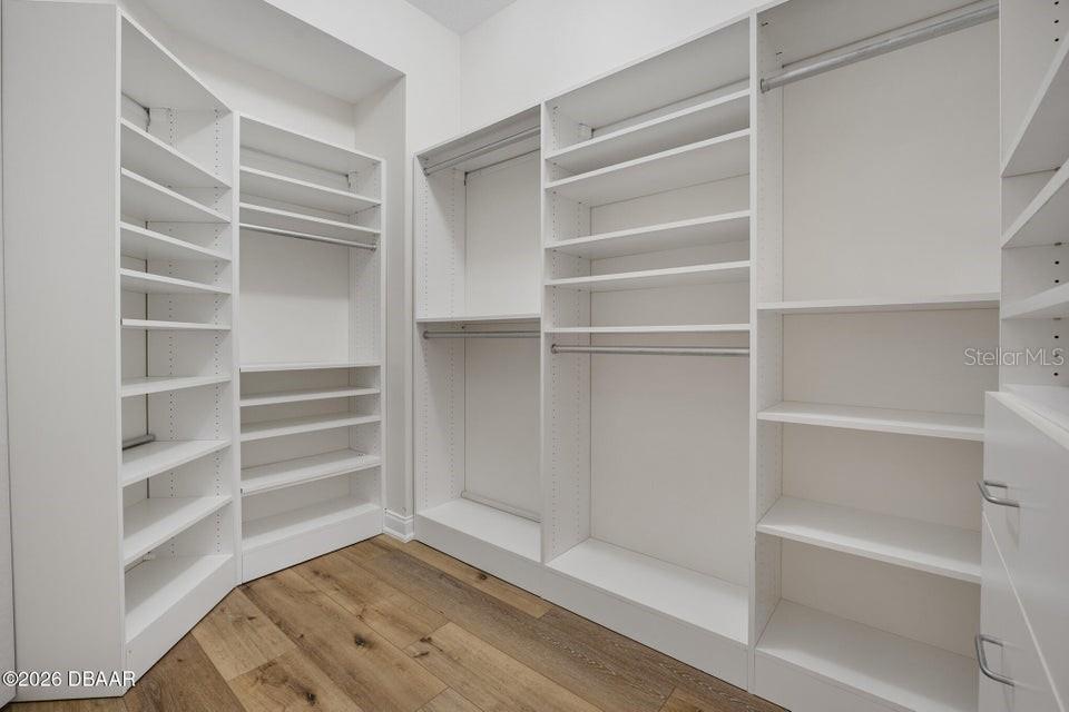 231 Riverside Drive, Unit 26011 Daytona Beach, FL 32117 - Photo 14 of 56 a view of walk in closet with empty racks