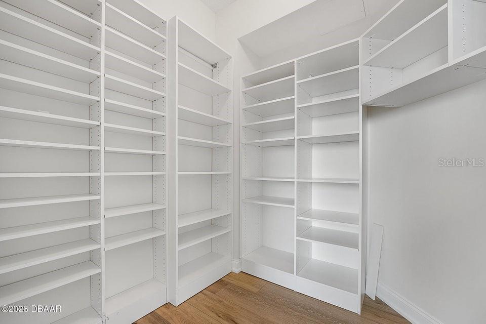 231 Riverside Drive, Unit 26011 Daytona Beach, FL 32117 - Photo 18 of 56 a view of an empty room with empty racks