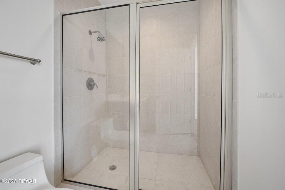 231 Riverside Drive, Unit 26011 Daytona Beach, FL 32117 - Photo 23 of 56 a bathroom with a shower