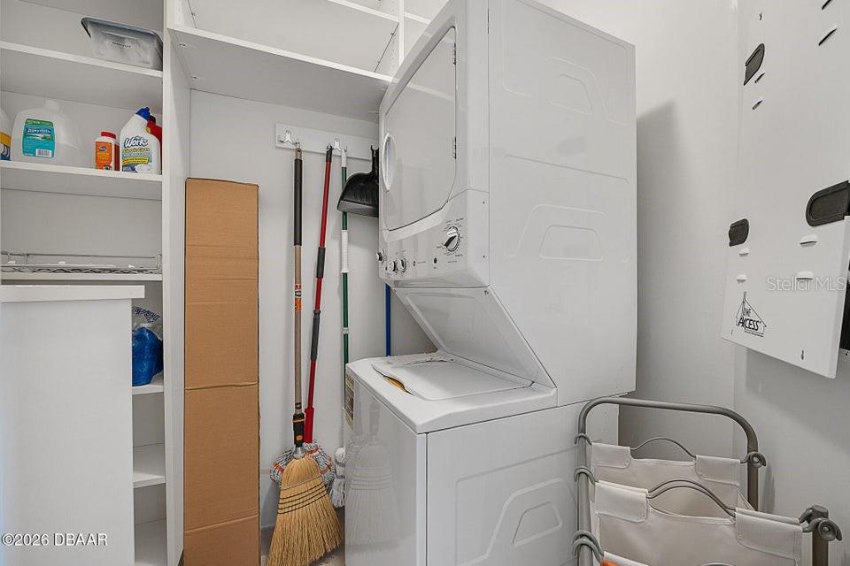 231 Riverside Drive, Unit 26011 Daytona Beach, FL 32117 - Photo 35 of 56 a utility room with dryer and washer
