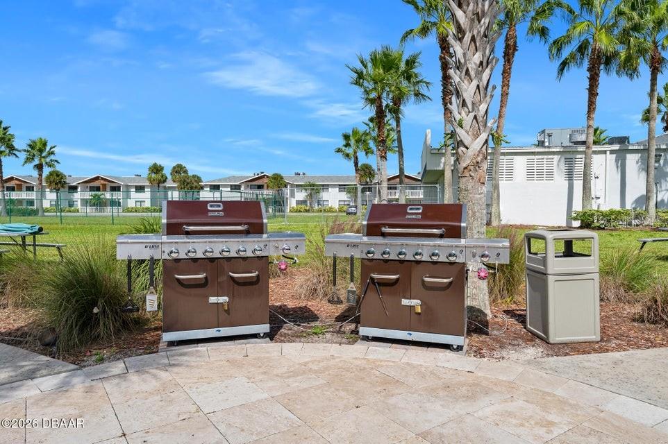 231 Riverside Drive, Unit 26011 Daytona Beach, FL 32117 - Photo 46 of 56 a view of a patio with a stove