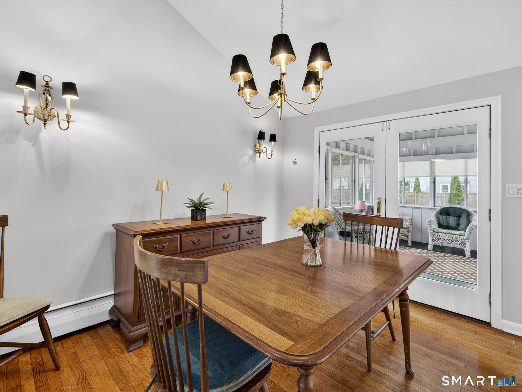 15 Buell Court Clinton, CT 06413 - Photo 8 of 29 Dining area with French doors to enclosed 3-season porch.