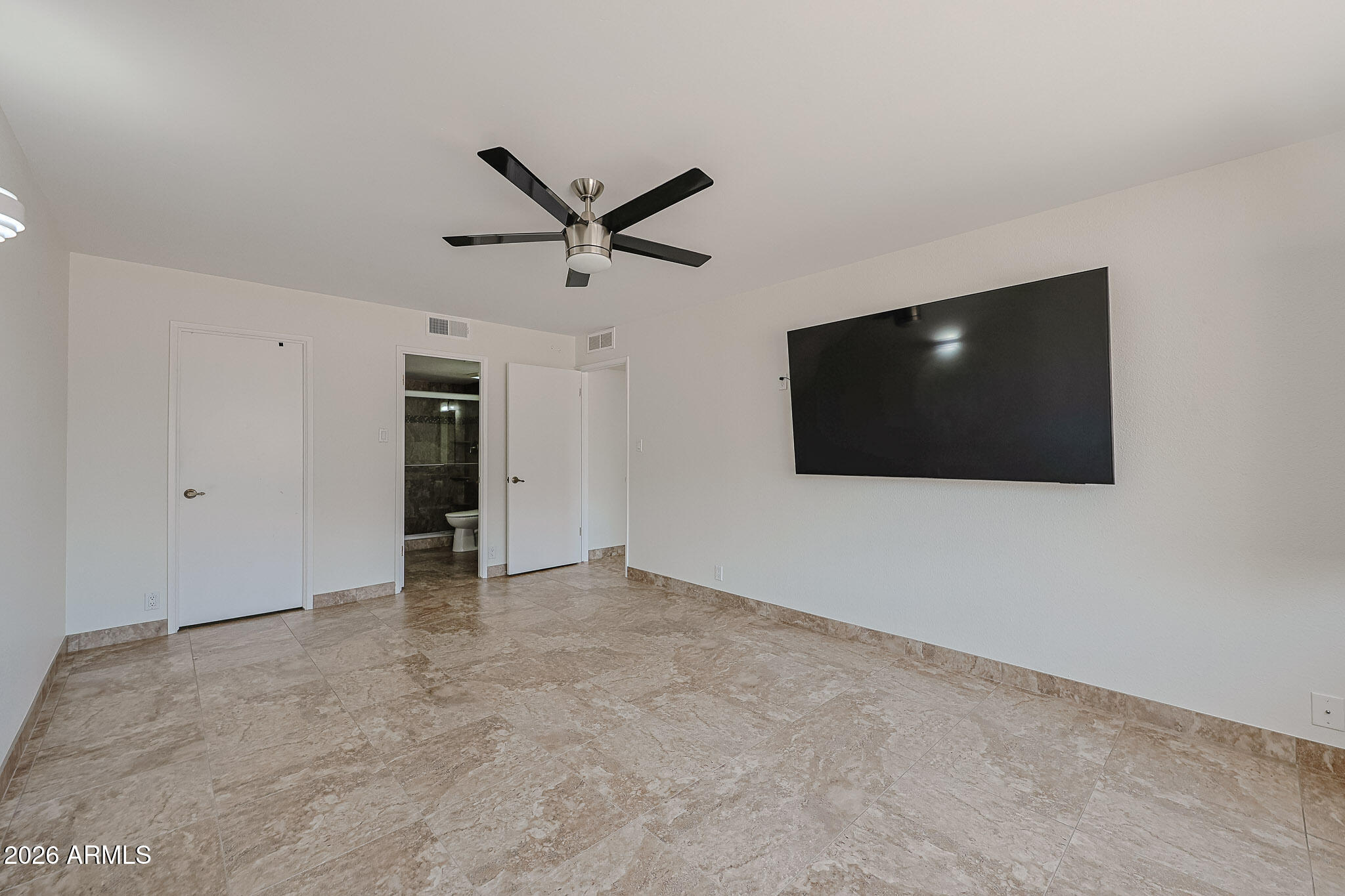7920 East Camelback Road, Unit 111 Scottsdale, AZ 85251 - Photo 13 of 32 a view of a livingroom with a flat screen tv