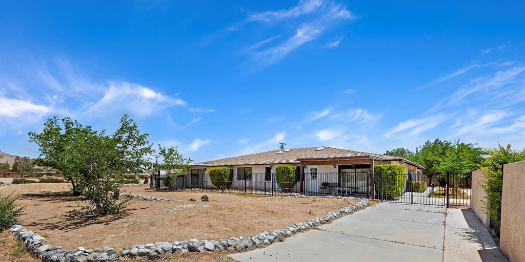 20115 Rimrock Road East Apple Valley, CA 92307 - Photo 1 of 1 a front view of a house with a yard