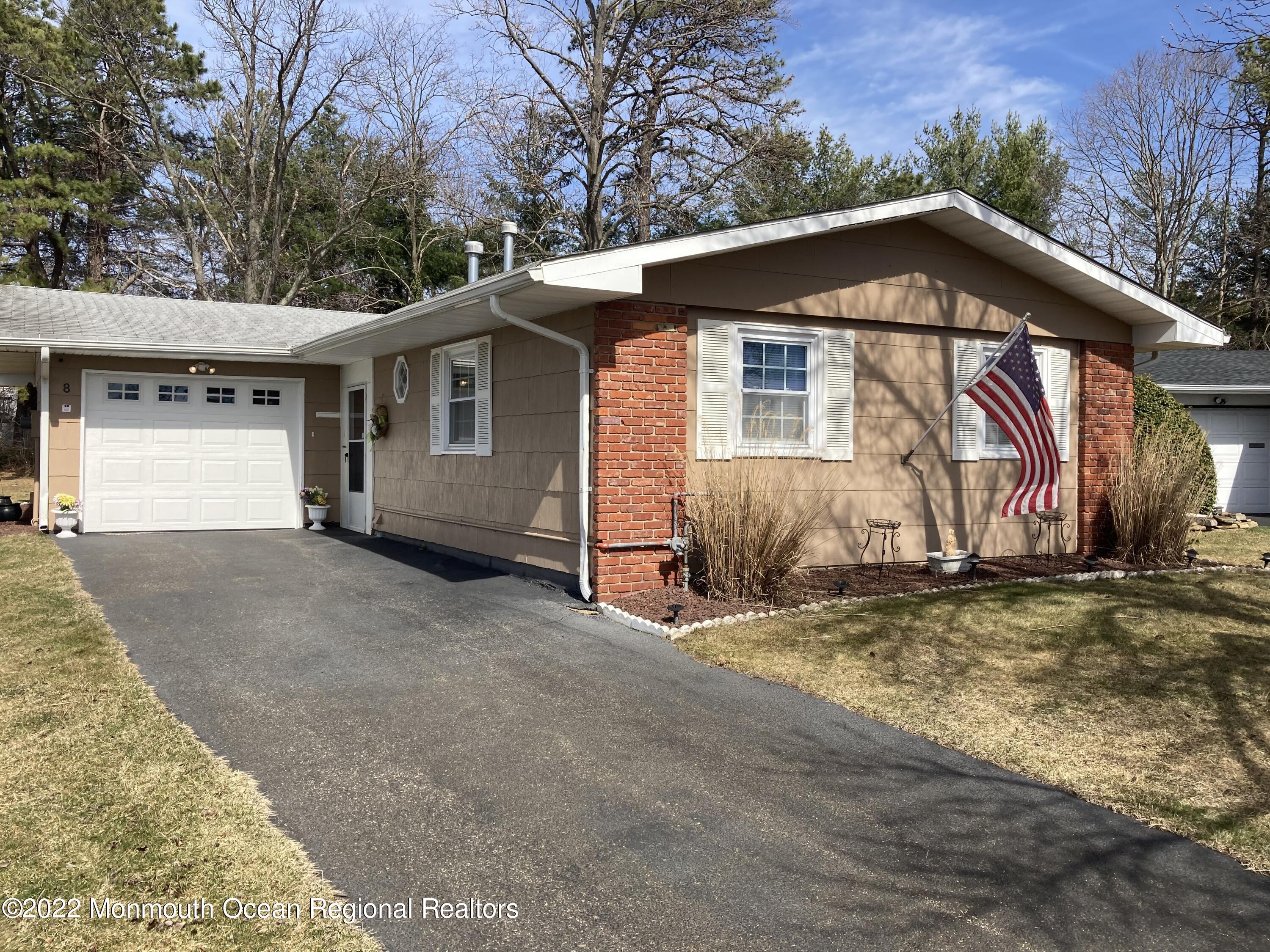 8 Masters Road Brick, NJ 08724 - Photo 1 of 11 a view of a house with a yard and garage