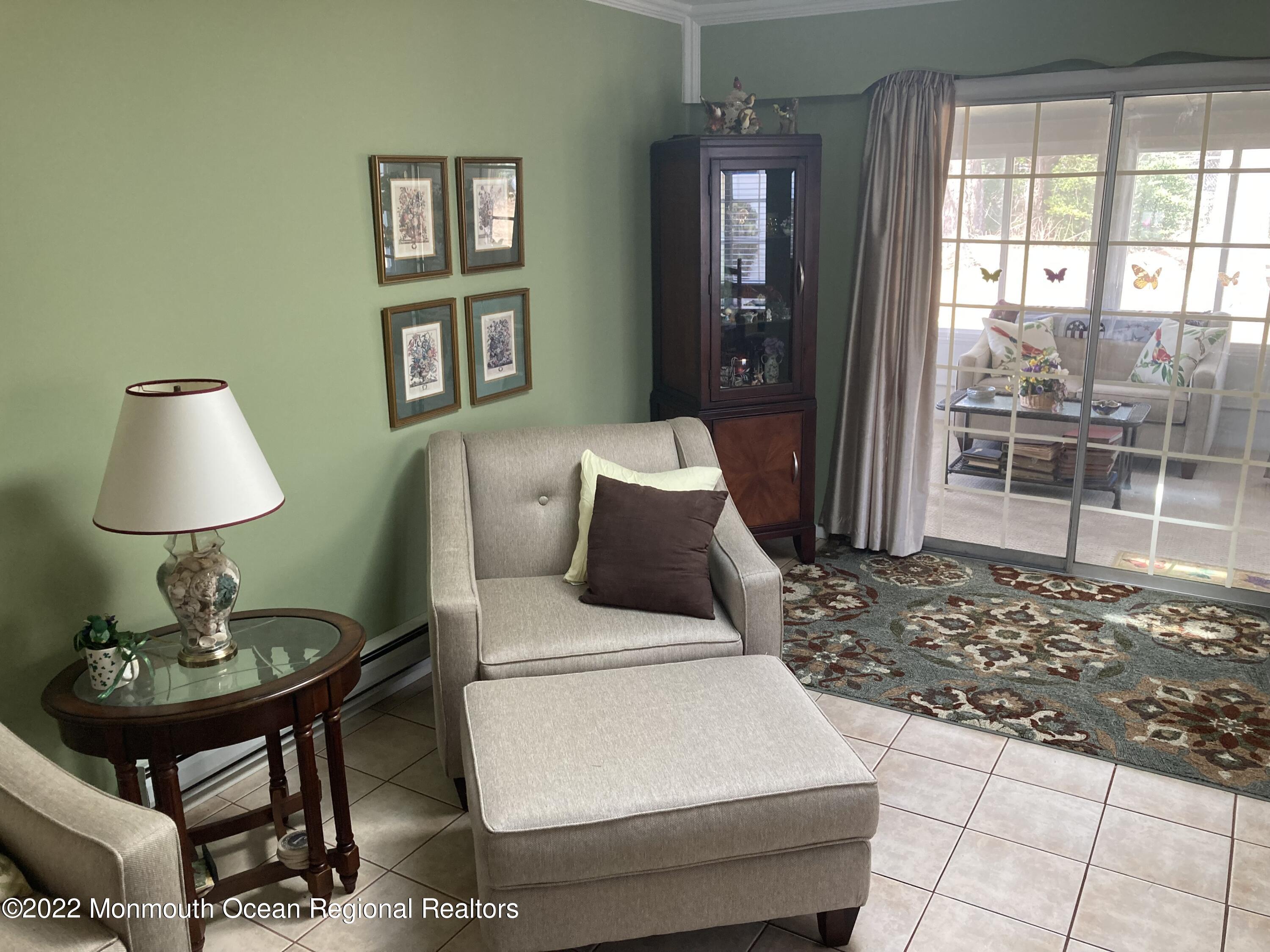 8 Masters Road Brick, NJ 08724 - Photo 4 of 11 a living room with a couch and a table