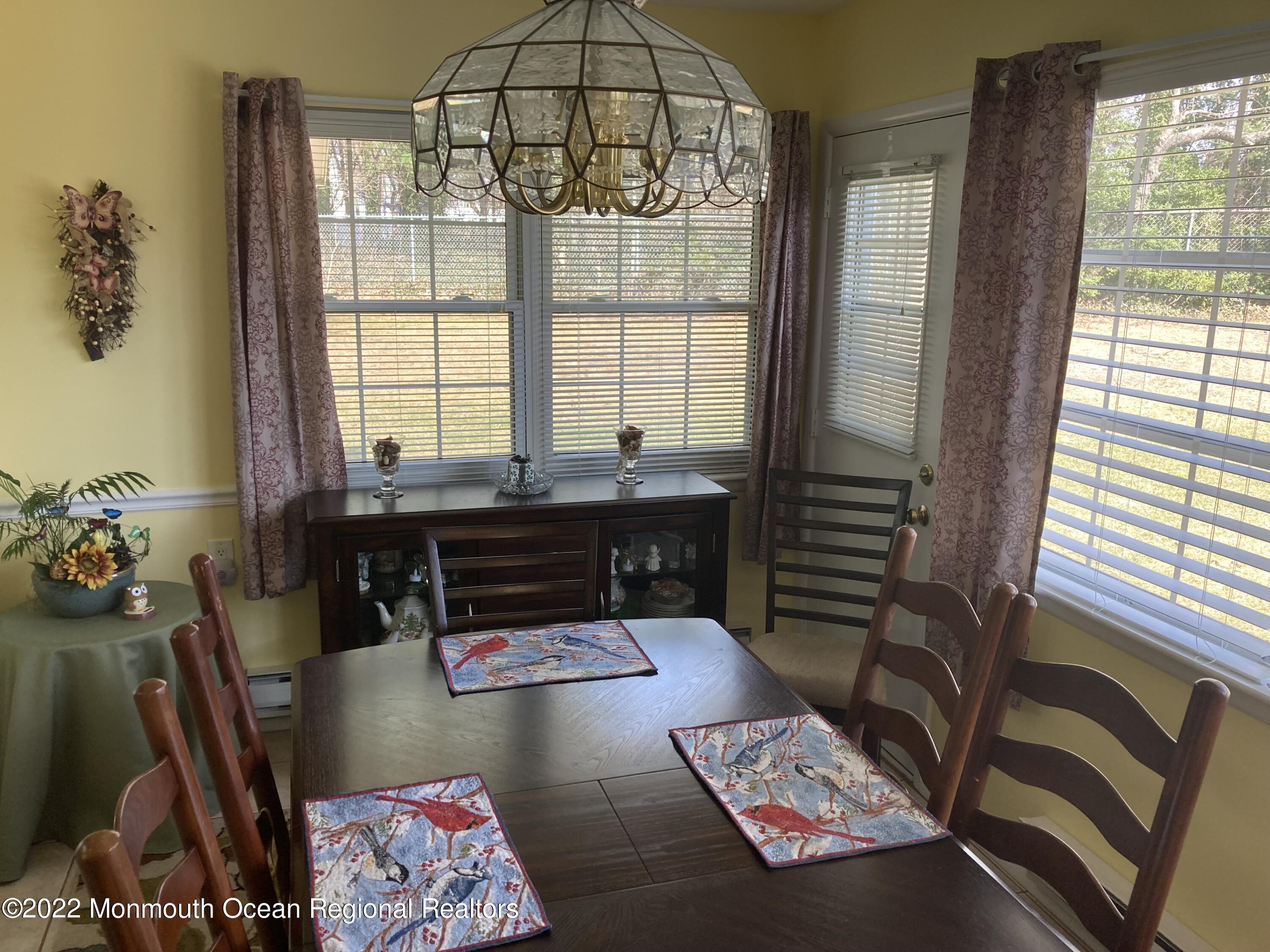 8 Masters Road Brick, NJ 08724 - Photo 6 of 11 a living room with furniture and a floor to ceiling window