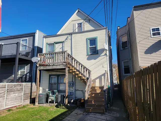 a view of house with backyard