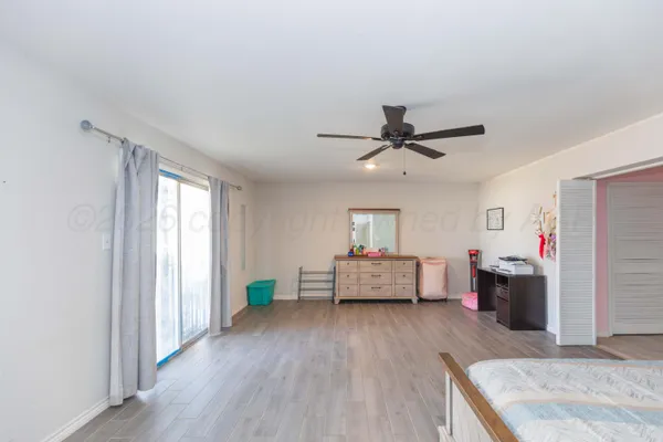 a bedroom with furniture and window